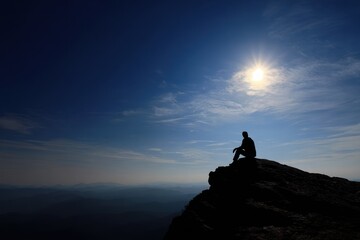 Male Silhouette on Cliff Against Vibrant Sky at Sunset, Embracing Freedom in Nature's Majesty