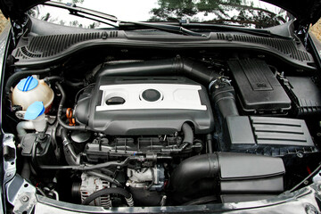 engine, open hood of a sports car. breakdown, repair. battery car engine detail motor. close-up of...