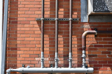 Natural gas manifold with multiple shutoff valves going to individual businesses.