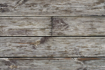 Rough texture of aged wooden boards with horizontal grooves