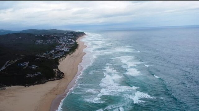  The coastal town of Sedgefield on the Garden Route camera down the coastline to Cola Beach 4K Aerial Video.