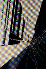 Abstract pixelated cityscape resembling a futuristic urban scene, distorted by RGB screen pixels...