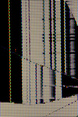 Close-up of a shattered LCD screen displaying colorful glitch patterns, horizontal scan lines, and abstract fractured shapes against darkness.