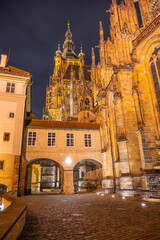 The illuminated Covered Bridge links architectural marvels at Prague Castle, highlighting the...
