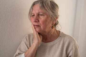 Elderly Woman Suffering from Toothache