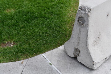 Cement barrier placed on sidewalk.