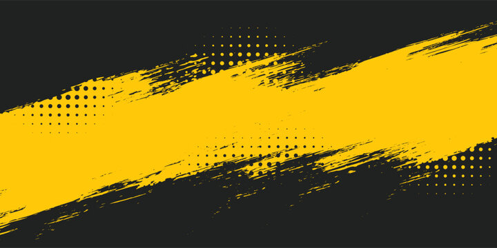 Yellow grunge brush streaks painting on black background