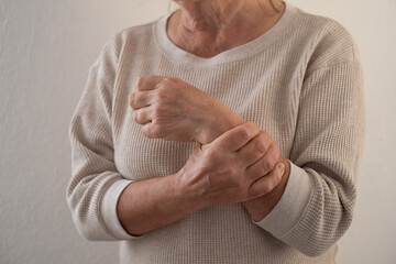 Elderly European Woman Suffering from Joint Pain, for Example in the Elbow