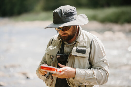 Experienced angler preparing for trout fishing adventure