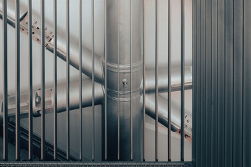 Metal framework and structural design observed through steel grating in an industrial setting...