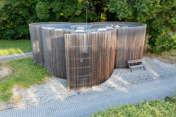 The building has organic shapes that completely contradict the conventional perception of public toilets. It consists of three intersecting circles. Is completely clad with wooden battens.