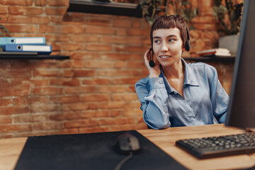 A skilled professional providing exceptional phone customer support in a modern office, ensuring...