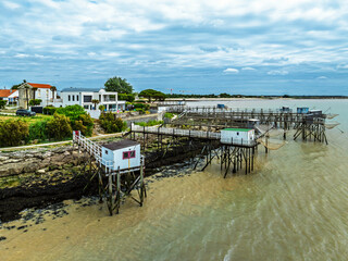 Fishing huts over Randonnee entre Histoire et Nature from a drone, Fouras, Fouras-les-Bains,...