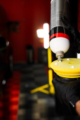 Applying compound to yellow polishing pad. Car detailing and paint correction preparation....