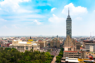 Obraz premium Crowd gathered in Mexico City for Independence Day military parade on September 16 with Bellas Artes and Torre Latinoamericana