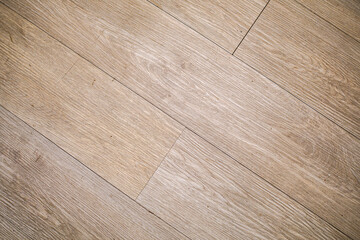 A textured surface showcasing parallel wooden planks, creating an authentic rustic backdrop. Its angled perspective adds depth and visual appeal, perfect for various creative projects.