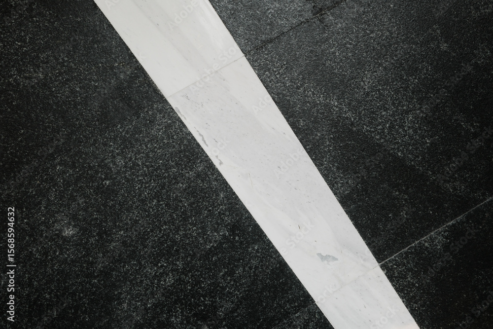 Poster abstract floor design with contrasting dark and light marble creates a striking visual effect