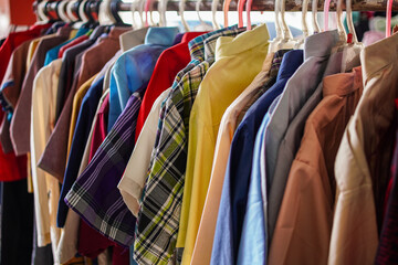 A vibrant collection of neatly hung shirts in diverse colors and patterns, perfect for illustrating...
