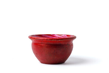 small children's toy jug made of clay isolated on white background