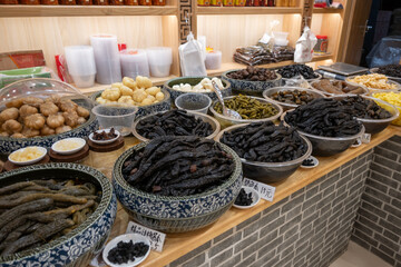 Bowls brimming with pickled vegetables, fruits, and roots. A Chinese delicacy, pickling ensures...