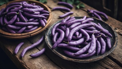 Obraz premium Purple beans on an old wooden table with fresh purple beans. Raw purple beans, selective focus, and empty space for text.