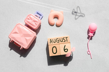Wooden block calendar with the date August 06
