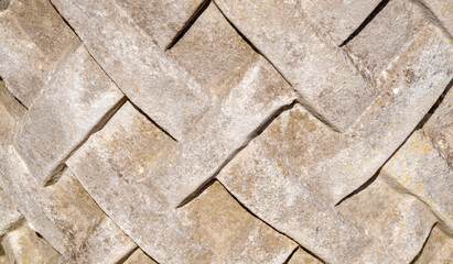 Interlaced cement on vase close-up texture.