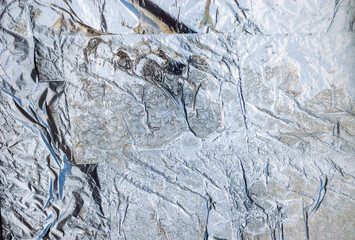 Texture of paper glued to glass window.