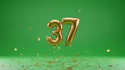 Golden metallic number thirty seven balloons with falling confetti on green background celebration - Powered by Adobe
