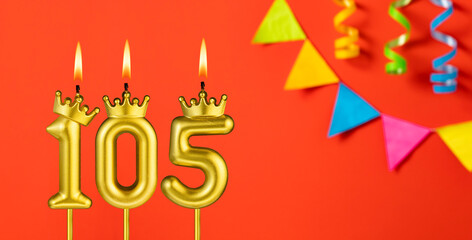 Number 105 candle - Birthday celebration on an orange background with pennants