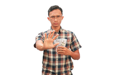 An Asian man holding a 100 dollar bill with a stop hand gesture