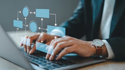 Business professional uses a laptop to create flowchart diagrams
