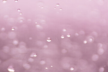 water droplet on pink bokeh background