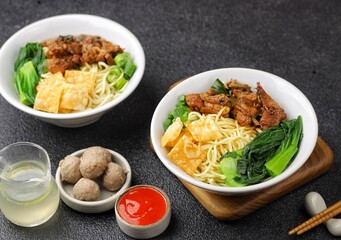 Mie ayam bakso. Bakso chicken noodles is a typical Indonesian dish made from wheat noodles seasoned with pieces of chicken and meatballs