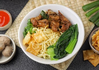 Mie Ayam. Chicken noodles are a typical Indonesian dish made from wheat noodles seasoned with pieces of chicken meat.