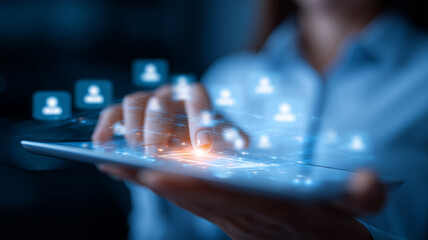 A business hand tapping holographic user cards that hover above a smartphone screen, representing mobile customer relationship management and digital networking engagement.
