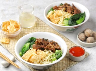 Mie ayam bakso. Bakso chicken noodles is a typical Indonesian dish made from wheat noodles seasoned with pieces of chicken and meatballs
