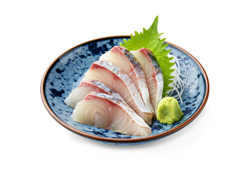 Plate presenting slices of fresh yellowtail (buri) sashimi, served as a side dish with a Spanish mackerel (sawara) set meal (teishoku) isolated on white