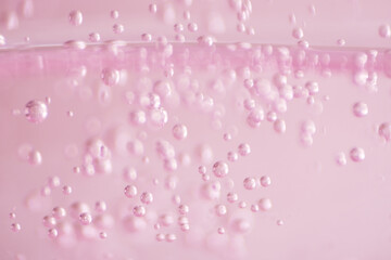 Macro bubbles of face serum as background