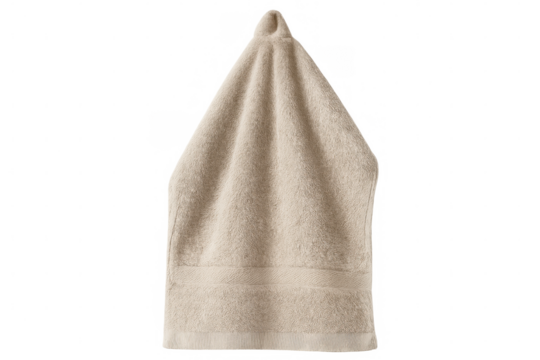 Plush beige towel suspended, revealing soft fabric texture and pristine readiness for bathroom or spa application