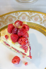 Raspberry key lime cake on a cake stand