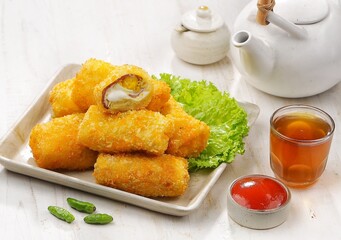 Risol Mayo or Risoles mayonnaise is a traditional roll-shaped snack that has various fillings, from ragout, eggs, to smoked beef.