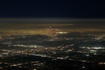 Thousands of fireworks glimmer across Greater Los Angeles on the 4th of July.