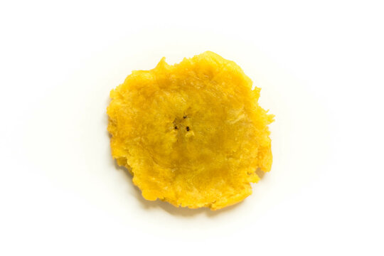 Tasty patac&oacute;n or tost&oacute;n, crispy fried green plantain popular in Latin American and Caribbean cuisine, isolated on white background for menus and blogs.