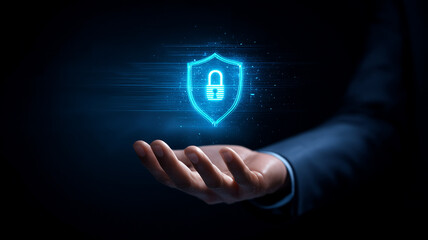 An outstretched business hand presenting a glowing padlock shield hologram, representing robust cybersecurity and data protection.
