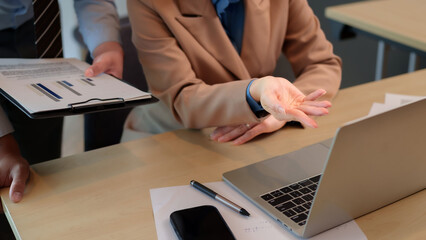 Adult professionals analyze data discuss financial report collaborate project office