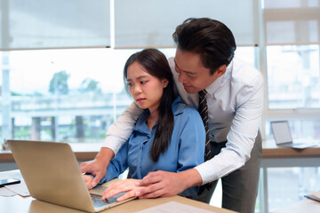 Business office workplace sexual harassment asian adult male inappropriately touching female...