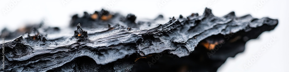 Aufkleber close-up of dark textured object with irregular surface