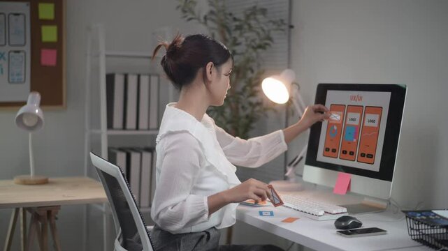 Asian ux designer woman working and planning application design software