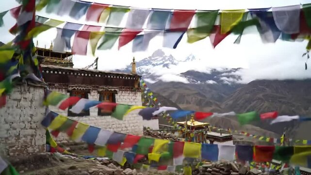 Colorful Tibetan prayer flags flutter in the wind against a backdrop of a remote Himalayan monastery and majestic mountains, embodying spirituality and ancient tradition.